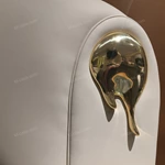 Beige Leather Upholstered Bed with Gold Stainless Steel Elephant Head Accents & Hammered Base Trim